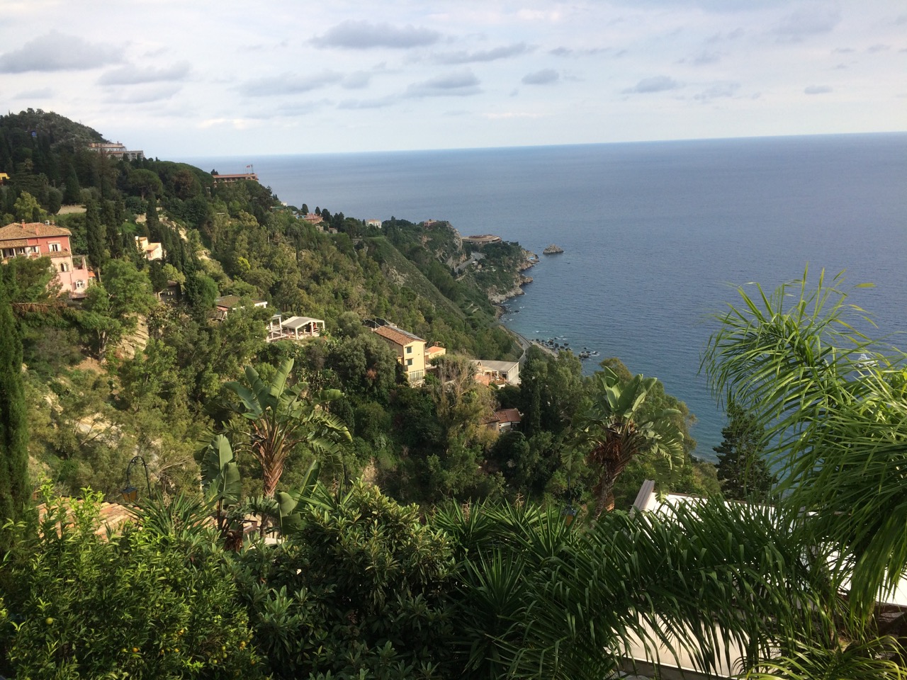 What draws visitors to Taormina